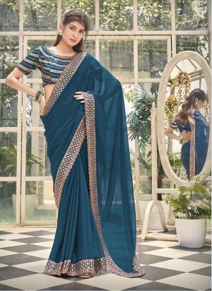 Looking These Fancy Party Wear Saree in Fine Colored.These Saree Are Zomato Shimmer And Blouse is Fabricated On Art Silk Pair.Its Beautified With Heavy Mirror,Jari Embroidery Work.