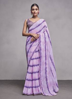 Looking These Party Wear Saree in Fine Colored.These Saree Are Georgette And Blouse is Fabricated On Fancy Art Silk Pair.Its Beautified With Solid Designer.