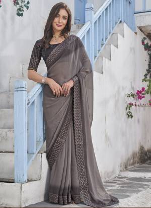 Garb These Fancy Saree in Fine Colored.These Saree Are Shimmer And Blouse is Fabricated On Art Silk Pair.Its Beautified With Pedding Color With Embroidery Work Border Blouse Disigner.