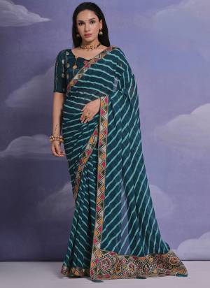 Grab These Festive Wear Saree in Fine Colored.These Saree is Fabricated On Georgette Pair With Mono Banglori Blouse.Its Beautified Designer Laheriya Printed With Multy Thread,Sequance,Coding Work Lace Border With Blouse.