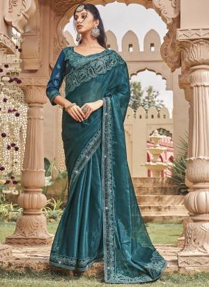 Looking These Fancy Party Wear Saree in Fine Colored.These Saree Are Shimmer And Blouse is Fabricated On Art Silk Pair.Its Beautified With Blooming Color With Heavy Embroidery Work Border Blouse.