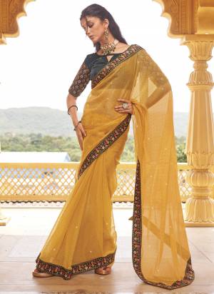 Looking These Fancy Party Wear Saree in Fine Colored.These Saree Are Shimmer And Blouse is Fabricated On Art Silk Pair.Its Beautified With Blooming Color With Heavy Embroidery,Swarovski Work Border Blouse.