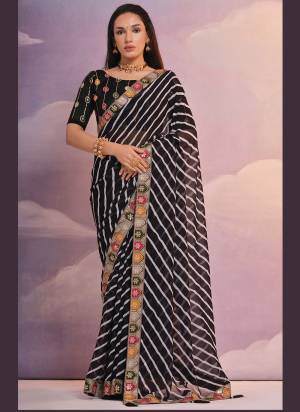 Grab These Festive Wear Saree in Fine Colored.These Saree is Fabricated On Georgette Pair With Mono Banglori Blouse.Its Beautified Designer Laheriya Printed With Sequance,Coding Work Lace Border,Blouse.