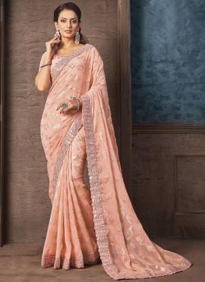 Look Attrective These Designer Party Wear Saree in Fine Light Colored.These Saree Are Georgette And Blouse Raw Silk is Fabricated.Its Beautified Heavy Wevon Designer With Embroidery Work.