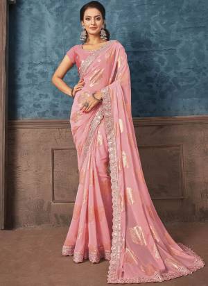 Look Attrective These Designer Party Wear Saree in Fine Light Colored.These Saree Are Georgette And Blouse Raw Silk is Fabricated.Its Beautified Heavy Wevon Designer With Embroidery Work.