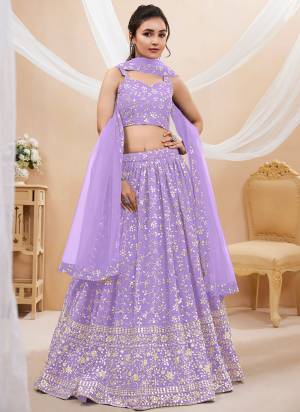 For A Designer Look,Grab These Lehenga Choli in Fine Colored.These Lehenga And Choli Are Fabricated On Georgette Pair With Soft Net Dupatta.Its Beautified With Designer Sequance,Jari Embroidery Work.