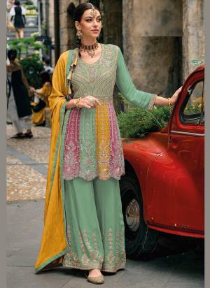 Garb These Designer Sharara Suits in Fine Colored Pair With Dupatta.These Top And Dupatta Are Fabricated On Chinon Pair With Chinon Bottom.Its Beautified With Heavy Designer Embroidery Work