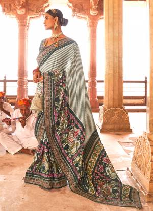 Looking These Party Wear Saree in Fine Colored.These Saree And Blouse is Fabricated On Smooth Silk.Its Beautified With Designer Patola Printed,Sequance,Jari Embroidery Work Blouse And Lace Border.