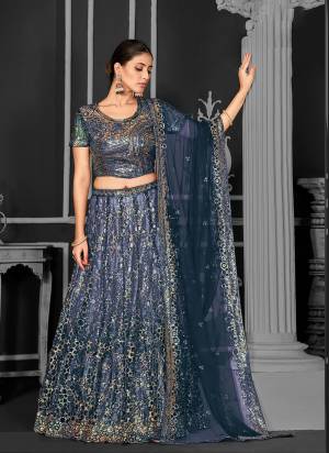 For A Designer Look,Grab These Lehenga Choli in Fine Colored.These Lehenga And Dupatta Are Fabricated On Net Pair With Net Blouse.Its Beautified With Designer Cord Floral Sequance Embroidery With Applique Work.