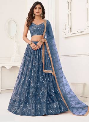 For A Different Look,Grab These Party Wear Designer Lehenga in All Over Pretty Colored Pair With Blouse And Dupatta.These Lehenga Choli And Dupatta is All Over Butterfly Net Base Fabric With Designer Thread,Sequance,Real Mirror Embroidery Work.