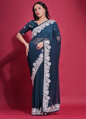 Attrective These Party Wear Saree in Fine Colored.These Saree is Fabricated On Georgette Pair With Mono Banglori Blouse.Its Beautified Designer Thread Embroidery Work.