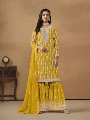 Garb These Party Wear Sharara Suit in Fine Colored Pair With Bottom And Dupatta.These Top And Dupatta Are Fabricated On Faux Georgette Pair With Santoon Bottom.Its Beautified With Santoon Inner.Its Beautified With Designer Heavy Embroidery Work.