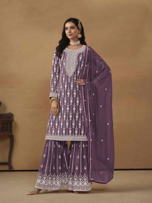 Garb These Party Wear Sharara Suit in Fine Colored Pair With Bottom And Dupatta.These Top And Dupatta Are Fabricated On Faux Georgette Pair With Santoon Bottom.Its Beautified With Santoon Inner.Its Beautified With Designer Heavy Embroidery Work.