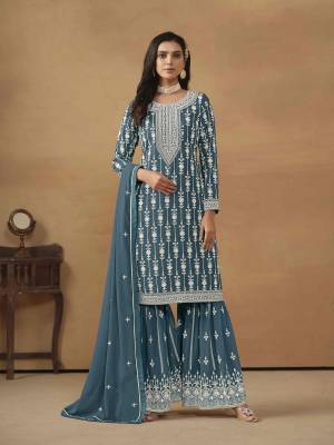 Garb These Party Wear Sharara Suit in Fine Colored Pair With Bottom And Dupatta.These Top And Dupatta Are Fabricated On Faux Georgette Pair With Santoon Bottom.Its Beautified With Santoon Inner.Its Beautified With Designer Heavy Embroidery Work.