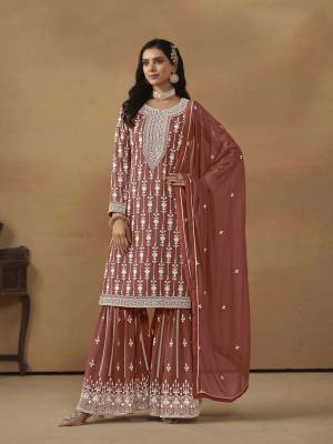 Garb These Party Wear Sharara Suit in Fine Colored Pair With Bottom And Dupatta.These Top And Dupatta Are Fabricated On Faux Georgette Pair With Santoon Bottom.Its Beautified With Santoon Inner.Its Beautified With Designer Heavy Embroidery Work.