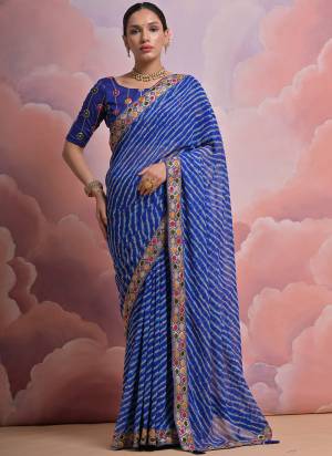 Looking These Festive Wear Saree in Fine Colored.These Saree is Fabricated On Georgette Pair With Mono Banglori Blouse.Its Beautified Designer Laheriya Printed With Multy Thread,Sequance,Coding Work Lace Border With Blouse.