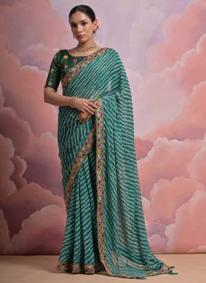 Looking These Festive Wear Saree in Fine Colored.These Saree is Fabricated On Georgette Pair With Mono Banglori Blouse.Its Beautified Designer Laheriya Printed With Multy Thread,Sequance,Coding Work Lace Border With Blouse.