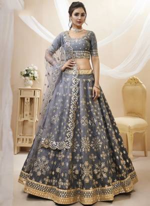 For A Designer Look,Grab These Lehenga Choli in Fine Colored.These Lehenga Are Art Silk And Blouse Are Fabricated On Art Silk Pair With Dupatta Are Soft Net.Its Beautified With Designer Jari,Sequance Embroidery Work.