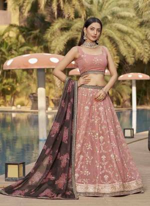 For A Designer Look,Grab These Lehenga Choli in Fine Colored.These Lehenga Are Georgette And Blouse Are Fabricated On Georgette Pair With Dupatta Are Organza.Its Beautified With Designer Jari,Sequance Embroidery Work.