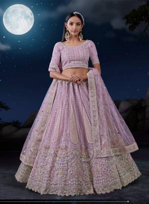 For A Designer Look,Grab These Lehenga Choli in Fine Colored.These Lehenga And Dupatta Are Fabricated On Soft Net Pair With Soft Net Blouse.Its Beautified With Heavy Designer Embroidery Work.