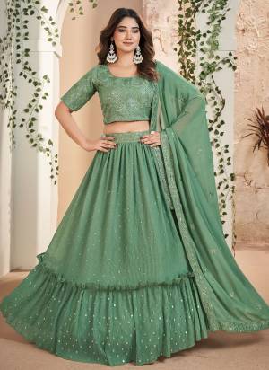 For A Designer Look,Grab These Lehenga Choli in Fine Colored.These Lehenga Are Faux Georgette And Dupatta Are Fabricated On Faux Georgette Pair With Faux Georgette Blouse.Its Beautified With Designer Thread,Sequance Embroidery Work.