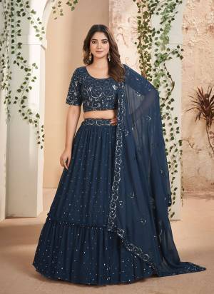 For A Designer Look,Grab These Lehenga Choli in Fine Colored.These Lehenga Are Faux Georgette And Dupatta Are Fabricated On Faux Georgette Pair With Faux Georgette Blouse.Its Beautified With Designer Thread,Sequance Embroidery Work.