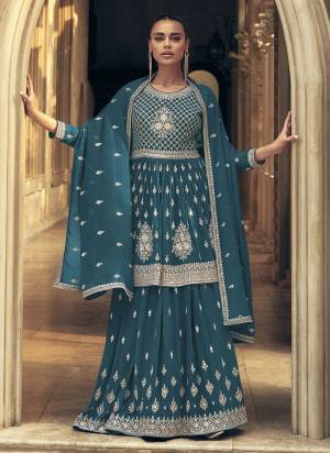 Garb These Party Wear Designer Gharara Suits in Fine Colored Pair With Dupatta.These Top And Dupatta Are Fabricated On Georgette Pair With Georgette Bottom.Its Beautified With Designer Heavy Embroidery Work