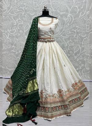 For A Fancy Designer Look,Grab These Lehenga Choli With Dupatta in Fine Colored.These Lehenga And Choli Are Gadhwal Silk And Dupatta Are Fabricated On Gajji Silk Pair.Its Beautified With Designer Hand Knitting Bandhej Dupatta With Cotton Thread Lakhnavi Embroidery Work.