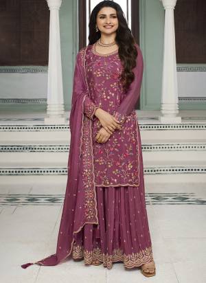 Garb These Designer Sharara Suits in Fine Colored Pair With Dupatta.These Top And Dupatta Are Fabricated On Chinon Pair With Chinon Bottom.Its Beautified With Blomming Color,Designer Thread,Sequance Embroidery Work