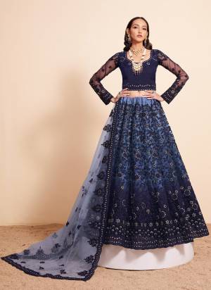 For A Designer Look,Grab These Lehenga Choli in Fine Colored.These Lehenga And Blouse Are Fabricated On Soft Net Pair With Soft Net Dupatta.Its Beautified With Designer Heavy Embroidery Work.