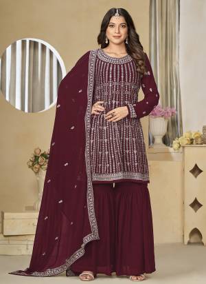 Garb These Party Wear Sharara Suit in Fine Colored Pair With Bottom And Dupatta.These Top And Dupatta Are Fabricated On Faux Georgette Pair With Santoon Bottom.Its Beautified With Santoon Inner.Its Beautified With Designer Heavy Embroidery Work.