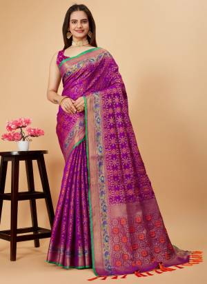 Garb This Partywear Saree Paired With Blouse.This Saree And Blouse Are Patola Silk Based Fabric With Weaving Jacquard Minakari Designer. Buy This Pretty Saree Now.