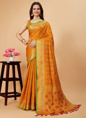 Garb This Partywear Saree Paired With Blouse.This Saree And Blouse Are Patola Silk Based Fabric With Weaving Jacquard Minakari Designer. Buy This Pretty Saree Now.