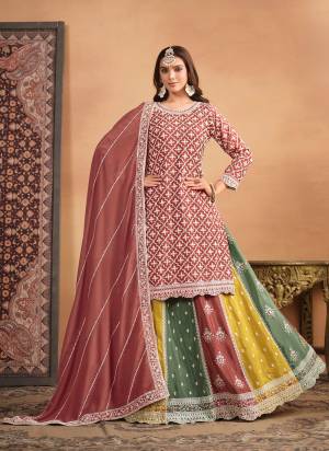 Looking These Designer Paty Wear Gharara Suit in Fine Colored Pair With Bottom And Dupatta.These Top And Dupatta Are Fabricated On Chinon Pair With Chinon Bottom.Its Beautified With Santoon Inner.Its Beautified With Heavy Designr Embroidery Work.