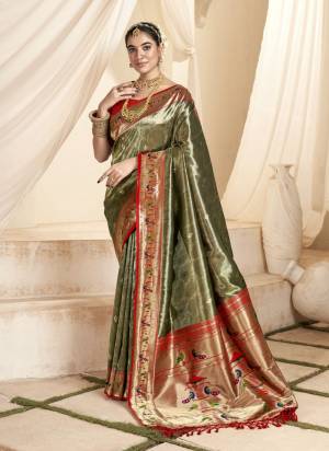 Looking These Party Wear Saree in Fine Colored.These Saree Is Soft Tissue Silk And Blouse is Fabricated On Silk.Its Beautified With Weaving Jari Designer.