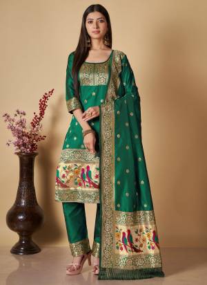 Garb This Suits In Lovely Color.Its Pretty Top Is Soft Banarasi Silk Based Paired Bottom Banarasi Silk And Banarasi Silk Fabricated Dupatta Are Wevon Jari,Thread Designer. Which Gives An Attractive To The Dress.