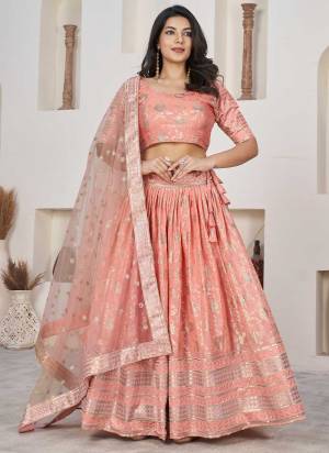 For A Designer Look,Grab These Lehenga Choli in Fine Colored.These Lehenga And Blouse Are Fabricated On Dolla Silk Pair With Net Dupatta.Its Beautified With Weaving Jacquard Designer With Embroidery Work.