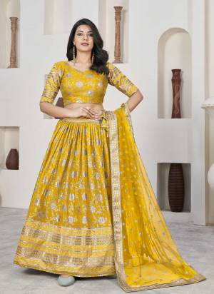 For A Designer Look,Grab These Lehenga Choli in Fine Colored.These Lehenga And Blouse Are Fabricated On Dolla Silk Pair With Net Dupatta.Its Beautified With Weaving Jacquard Designer With Embroidery Work.