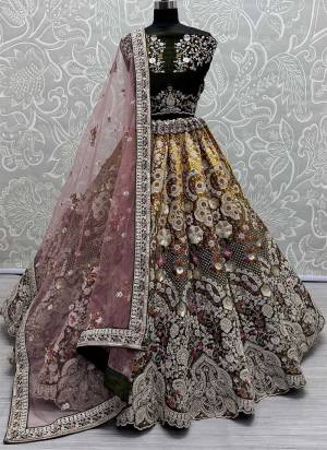 For A Fancy Designer Look,Grab These Lehenga Choli With Dupatta in Fine Colored.These Lehenga And Choli Are Velvet And Dupatta Are Fabricated On Soft Net Pair.Its Beautified With Pedding Color,Designer Jari,Sequance,Thread Embroidery With Zarkan Diamond Work.