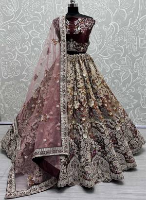 For A Fancy Designer Look,Grab These Lehenga Choli With Dupatta in Fine Colored.These Lehenga And Choli Are Velvet And Dupatta Are Fabricated On Soft Net Pair.Its Beautified With Pedding Color,Designer Jari,Sequance,Thread Embroidery With Zarkan Diamond Work.