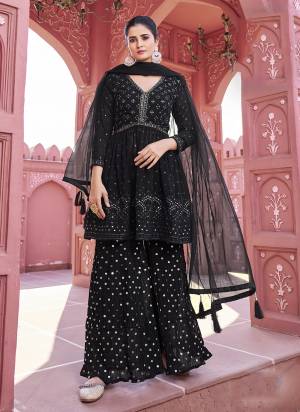 Attrective Looking These Sharara Suit in Fine Colored Pair With Bottom And Dupatta.These Top And Bottom Are Fabricated On Georgette Pair With Net Dupatta.Its Beautified With Heavy Designer Mirror,Thread Embroidery Work.