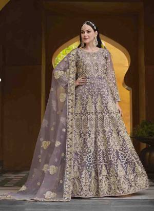 Garb These Anarkali Suit in Fine Colored Pair With Bottom And Dupatta.These Top Are Butterfly Net And Dupatta Are Fabricated On Butterfly Net Pair With Japan Satin Bottom.Its Beautified With Designer Heavy Embroidery With Stone Work.