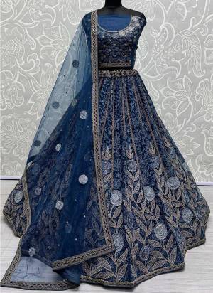 For A Fancy Designer Look,Grab These Lehenga Choli With Dupatta in Fine Colored.These Lehenga And Choli Are Net And Dupatta Are Fabricated On Soft Net Pair.Its Beautified With Designer Jari,Dori,Sequance,Thread Embroidery Work.