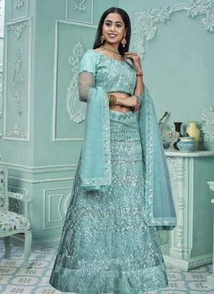 Grab These Beautiful Colored Lehenga Choli.These Lehenga and Dupatta Are Fabricated On Net Pair With Net Blouse.Its Beautified With Heavy Thread,Sequance Embroidery Work.