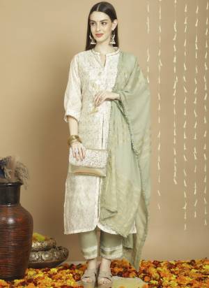 Attrective This Designer Long Length Suit In Lovely Color.Its Pretty Heavy Designer Embroidery Work Top Is Art Silk Based Paired With Russian Silk Bottom And Cotton Fabricated Dupatta Which Gives An Attractive To The Suit.