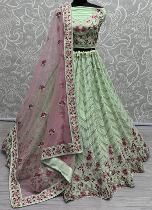 For A Fancy Designer Look,Grab These Lehenga Choli With Dupatta in Fine Colored.These Lehenga And Choli Are Georgette And Dupatta Are Fabricated On Soft Net Pair.Its Beautified With Designer Multy Thread,Jari Embroidery With Zarkan Diamond Work.