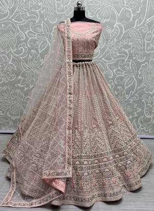 For A Fancy Designer Look,Grab These Lehenga Choli With Dupatta in Fine Colored.These Lehenga And Choli Are Net And Dupatta Are Fabricated On Soft Net Pair.Its Beautified With Designer Sequance,Dori,Multy Thread Embroidery With Zarkan Diamond Work