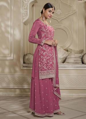 Attrective Looking These Special Sharara Suit in Fine Colored Pair With Bottom And Dupatta.These Top Are Chinon And Dupatta Are Fabricated On Art Silk Pair With Chinon Bottom.Its Beautified With Heavy Designer Heavy Embroidery Work.