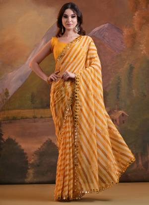 Garb These  Saree in Fine Colored.These Saree Are Georgette And Blouse is Mono Banglori Fabricated.Its Beautified With Laheriya Printed, Foil Printed With Mirror Lace Work.