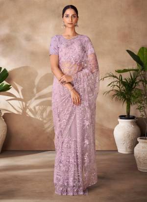 Looking These Party Wear Saree in Fine Colored.These Saree Are Net And Blouse is Fabricated On Net Pair.Its Beautified With Designer Heavy Thread,Sequance Embroidery,Zarkan Work.